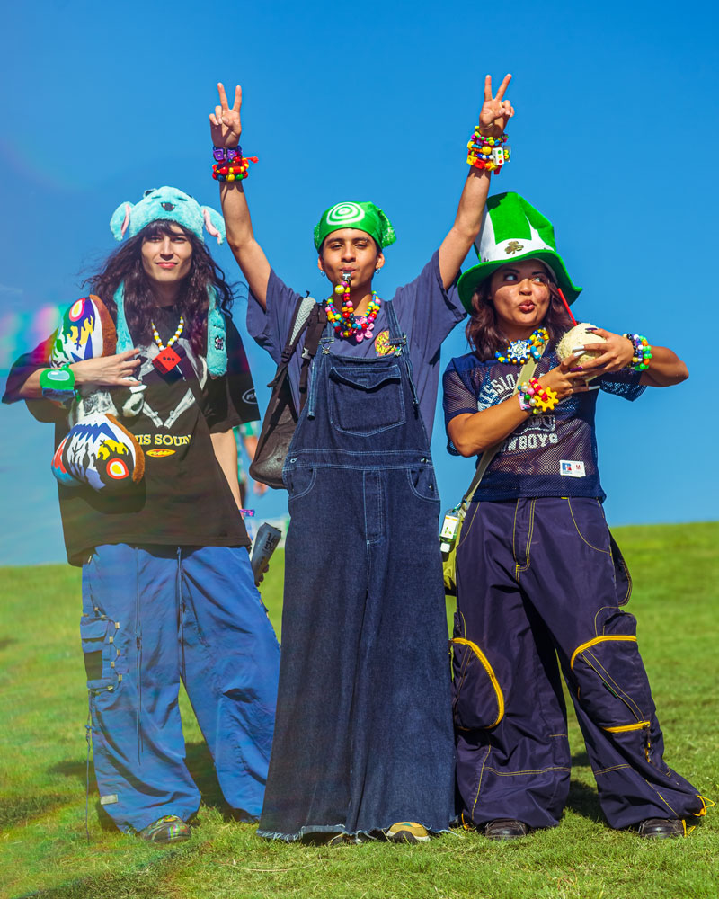 3 people in raver outfits