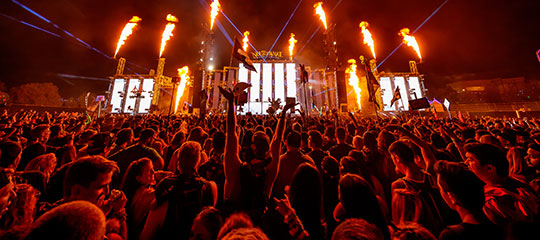 Headliners with their hands in the air