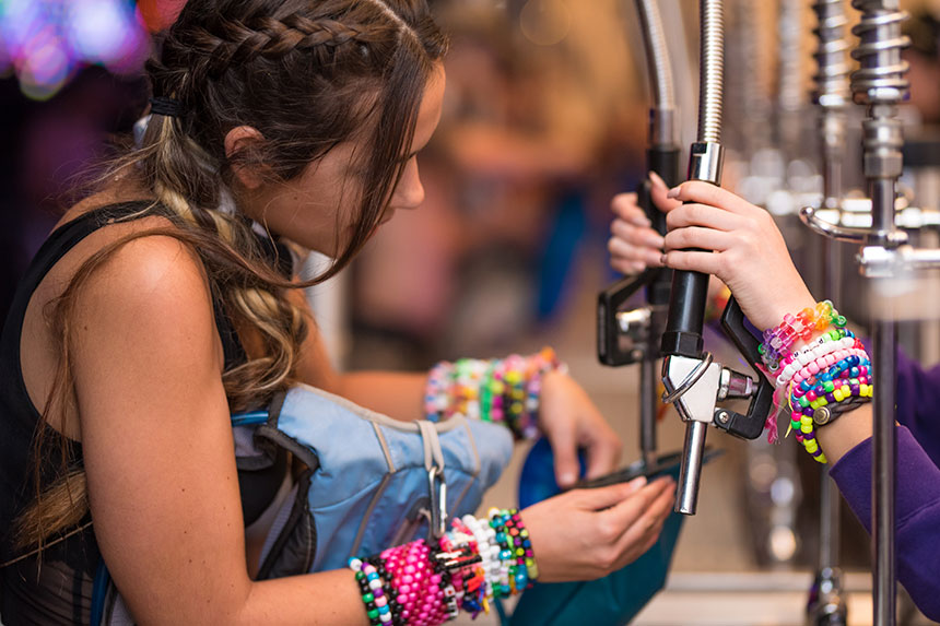 A girl refilling her hydration pack