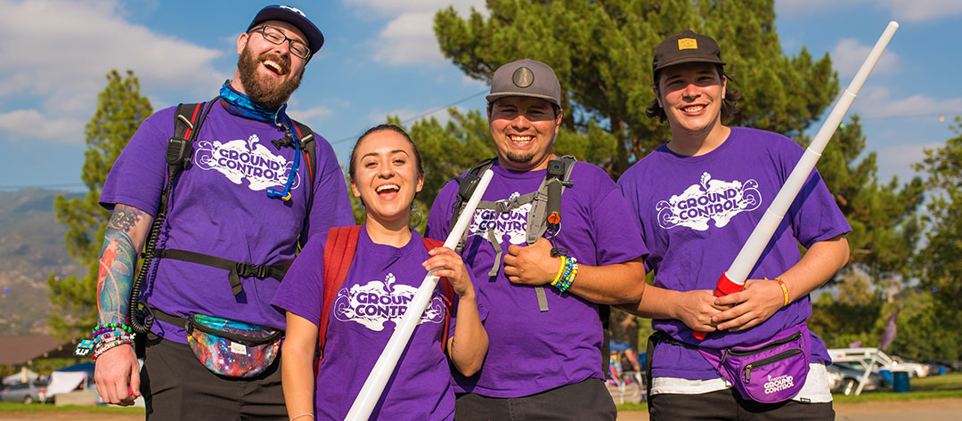 Ground Control team members with light sabers