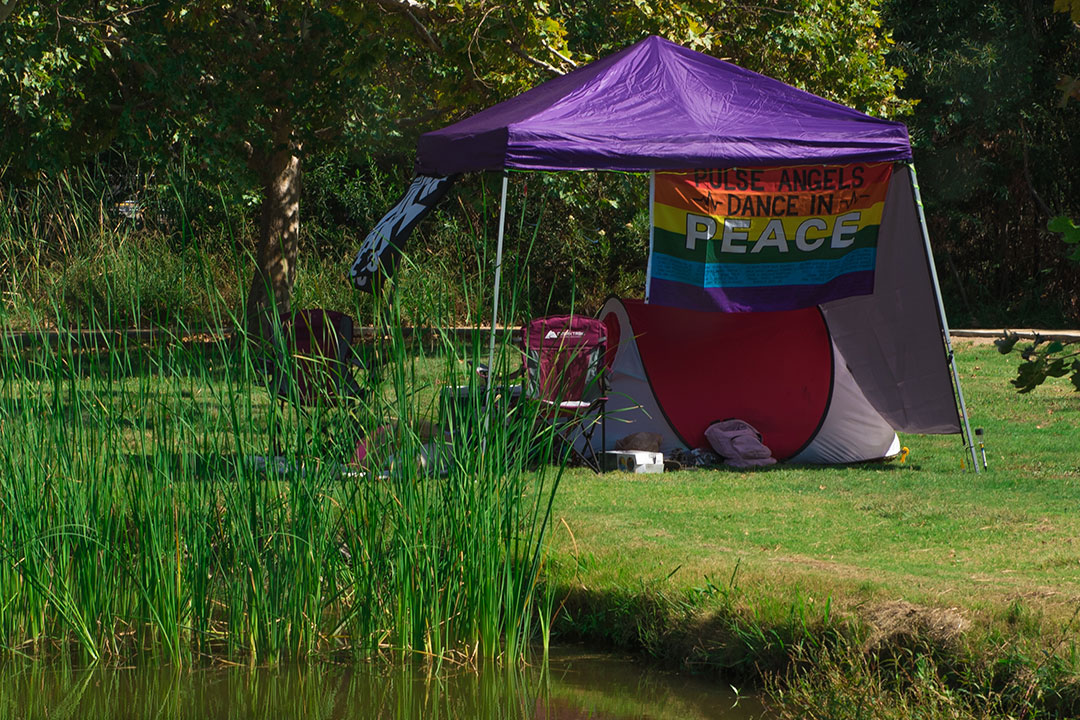 A tent with a commemorative Pulse flag