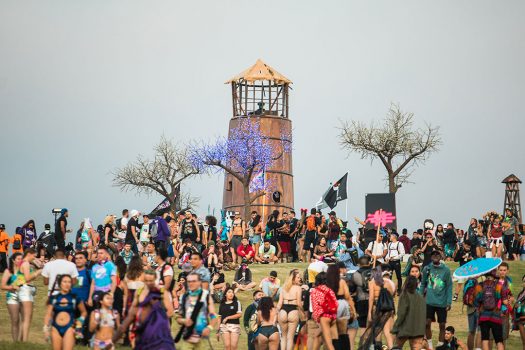 Headliners hanging out by the lighthouse
