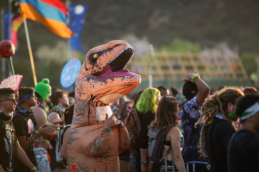 A Headliner in a dinosaur costume