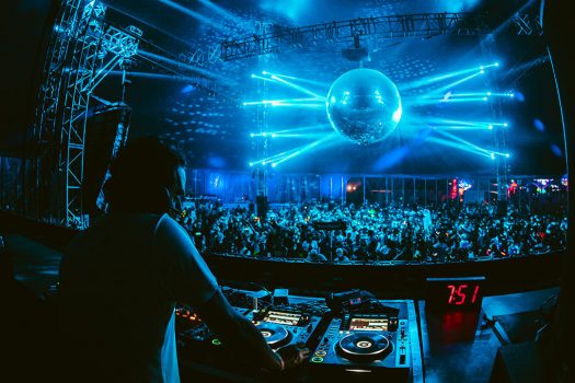 A disco ball shines during a DJ set