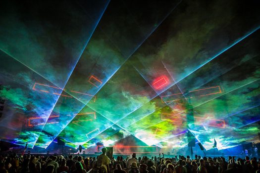 Lasers shoot over the crowd