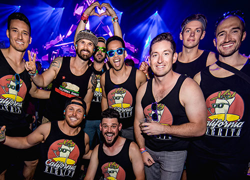 A group of smiling Headliners in matching tank tops