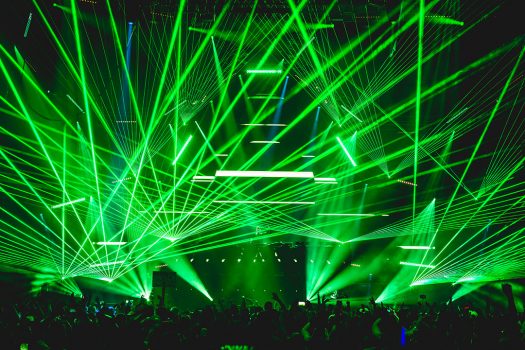Green lasers beam from the stage
