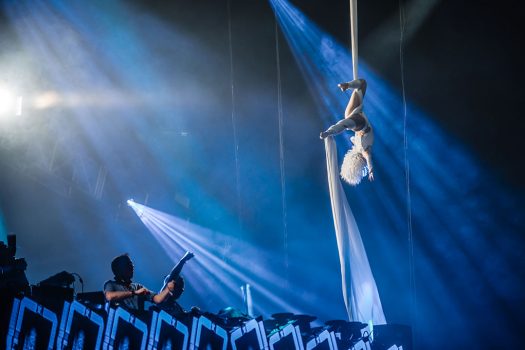 An aerialist performs on silk