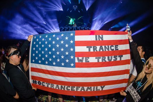 Headliners with an "In Trance We Trust" flag