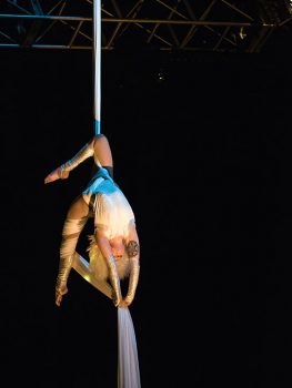 An aerialist performing on silk