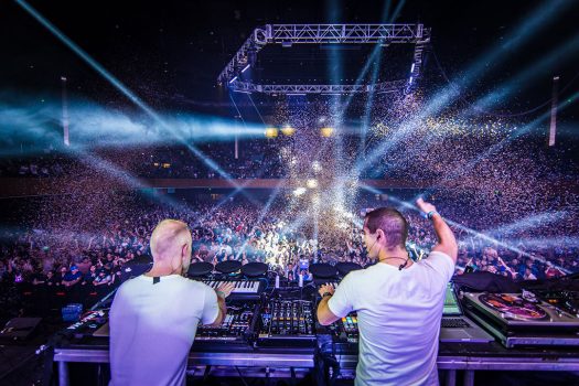 Two DJs performing for the crowd