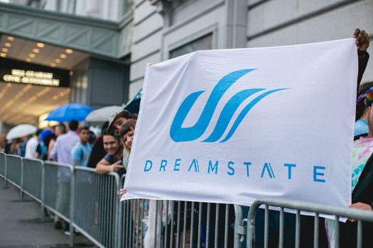 Headliners outside with a Dreamstate flag