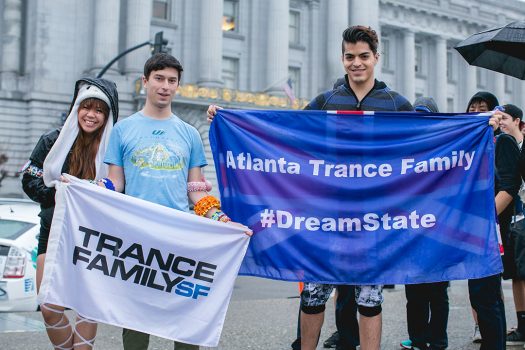 Headliners outside the venue with Trance Family flags