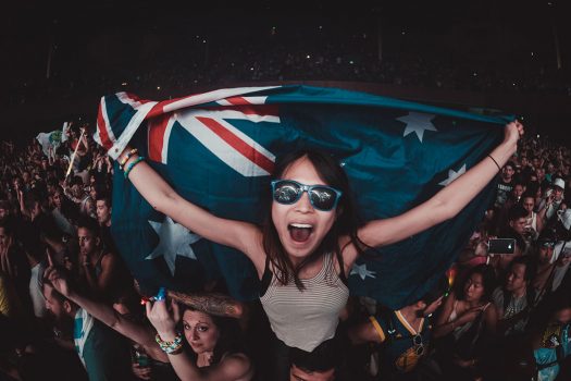 A Headliner with sunglasses and a flag