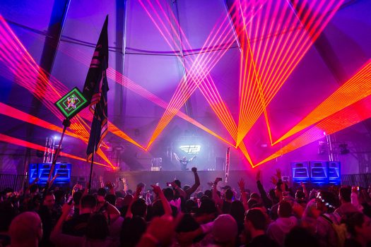 Lasers shoot out from the stage