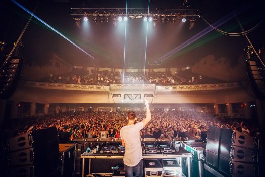 A DJ points upward