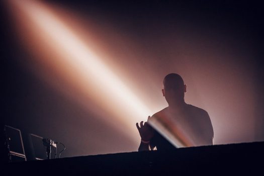 A DJ in silhouette