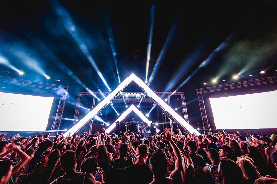 Lights shine from the stage