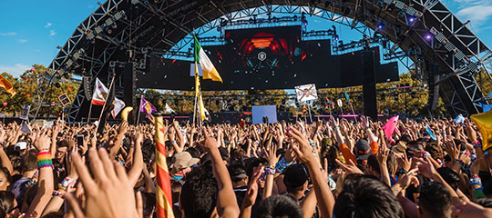 Headliners with their hands in the air