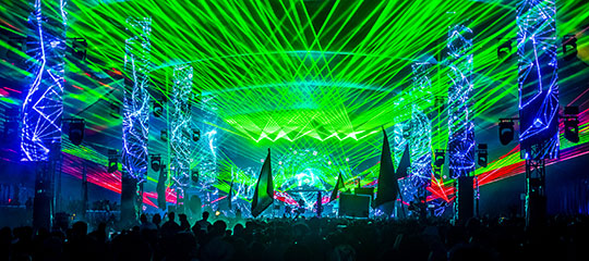 Green lasers shoot from the stage