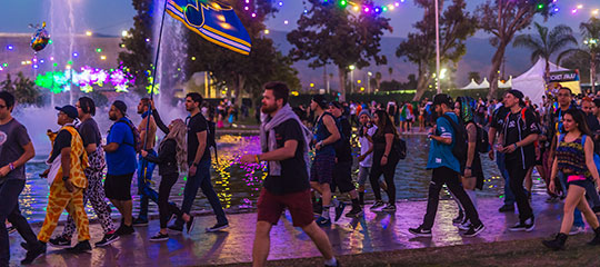 Headliners walking past the lake