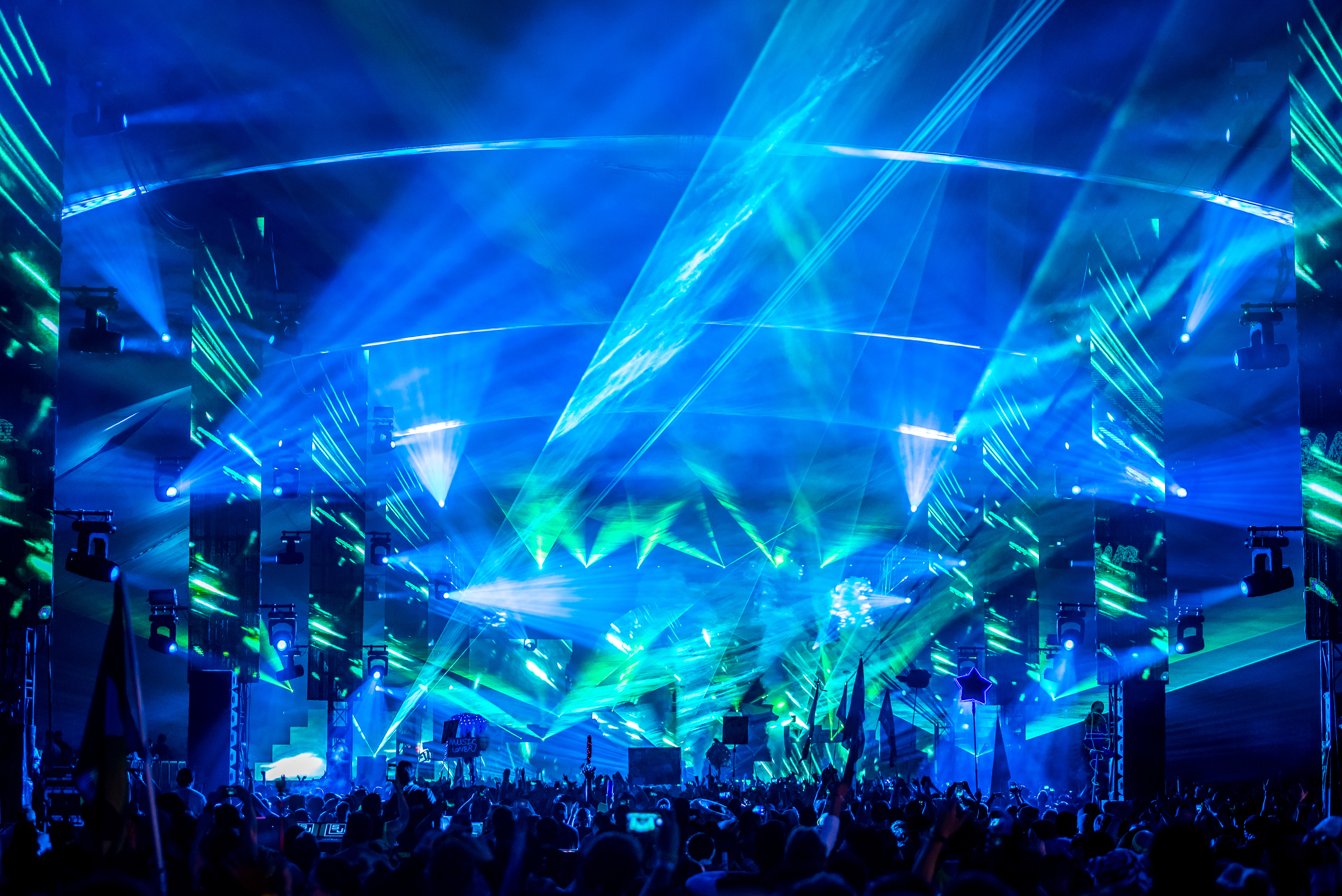 Blue and green lights emanating from the stage