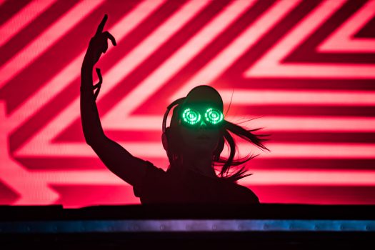 Rezz with her hand up