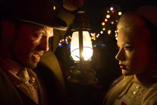 The Hatter and Alice with a lantern