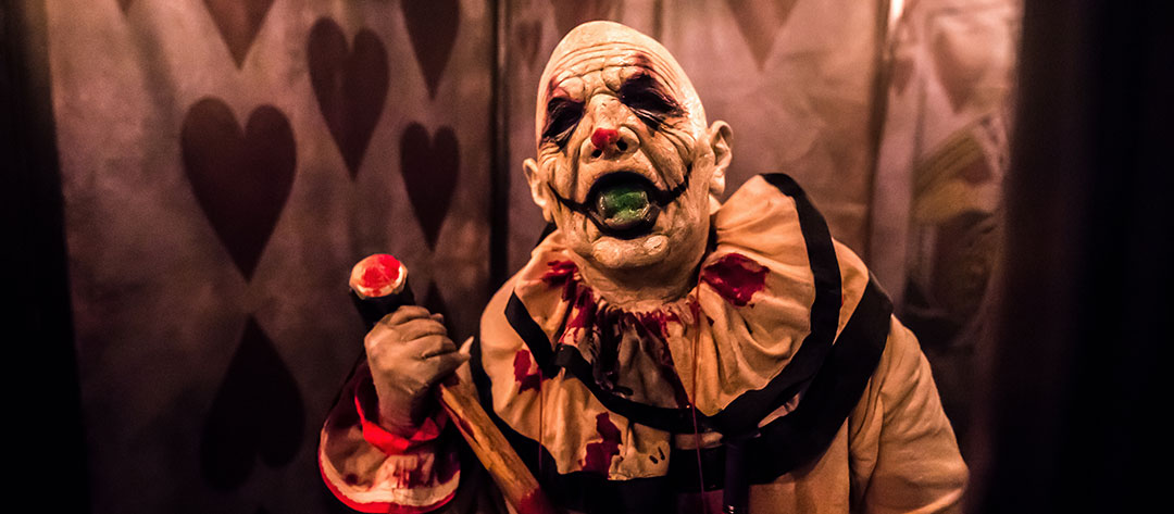 A scary clown with a mallet
