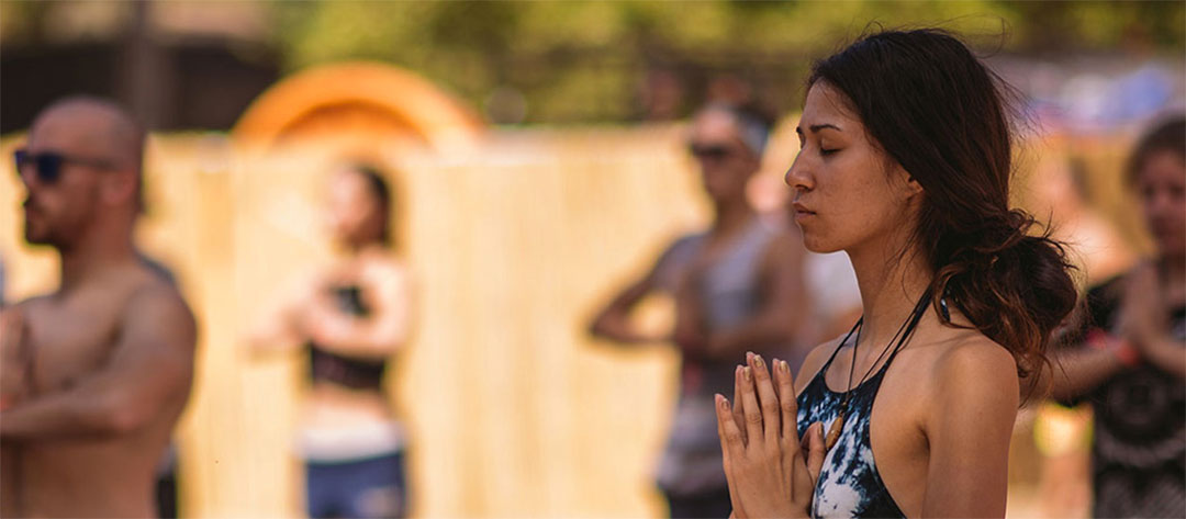 Yogis with hands in prayer