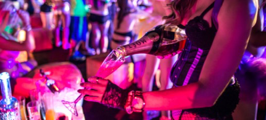 A woman pouring champagne