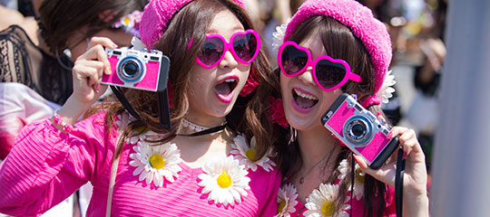 Two girls with pink cameras