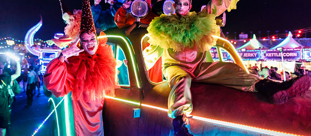 Clown performers on an art car