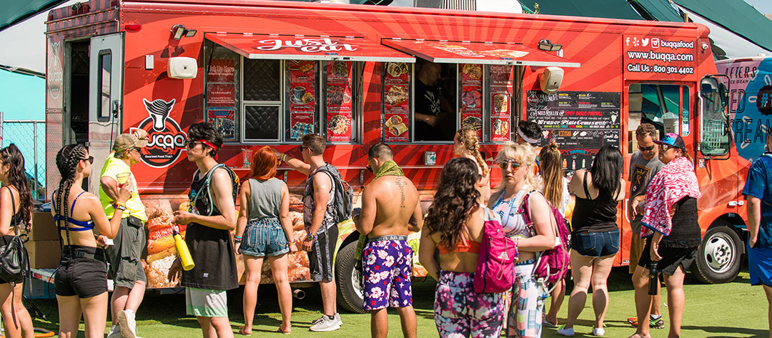 People lining up at a food truck