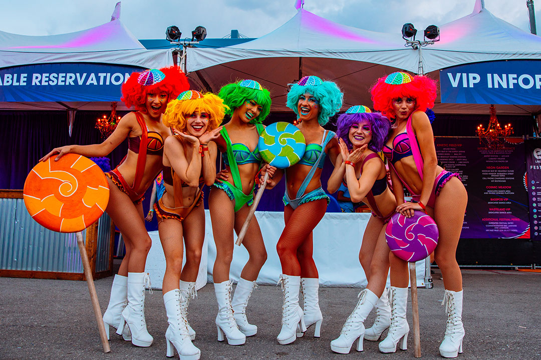 Performers with giant lollipops