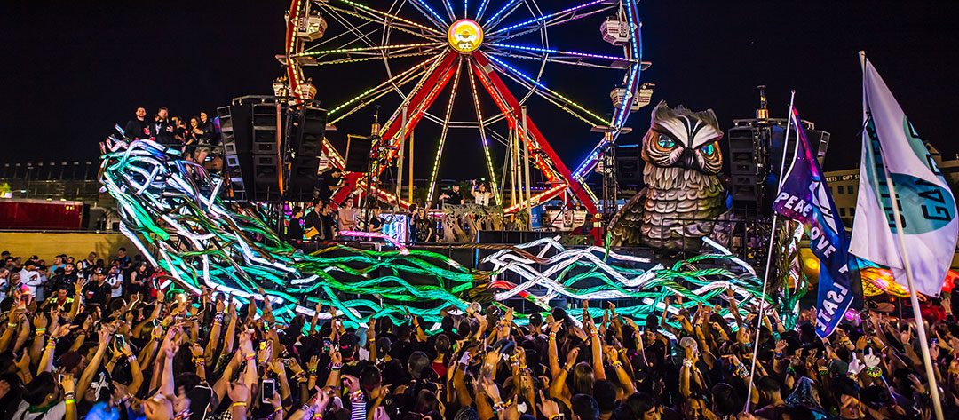 A ferris wheel and an art car