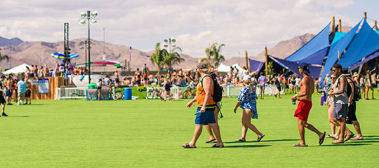 People walking through Camp EDC