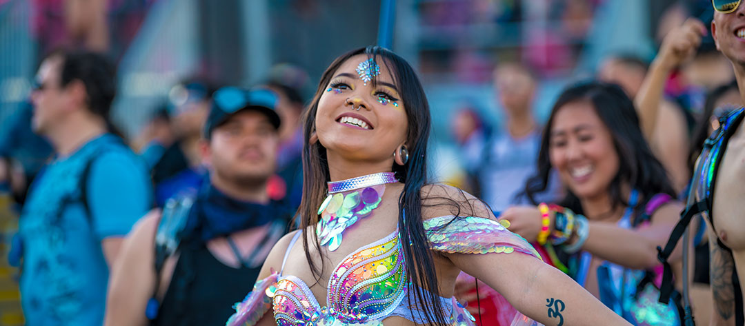 A woman smiles and dances