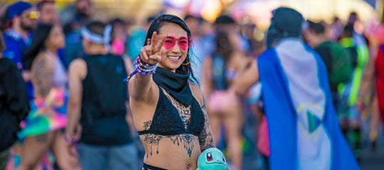 A woman making a peace sign