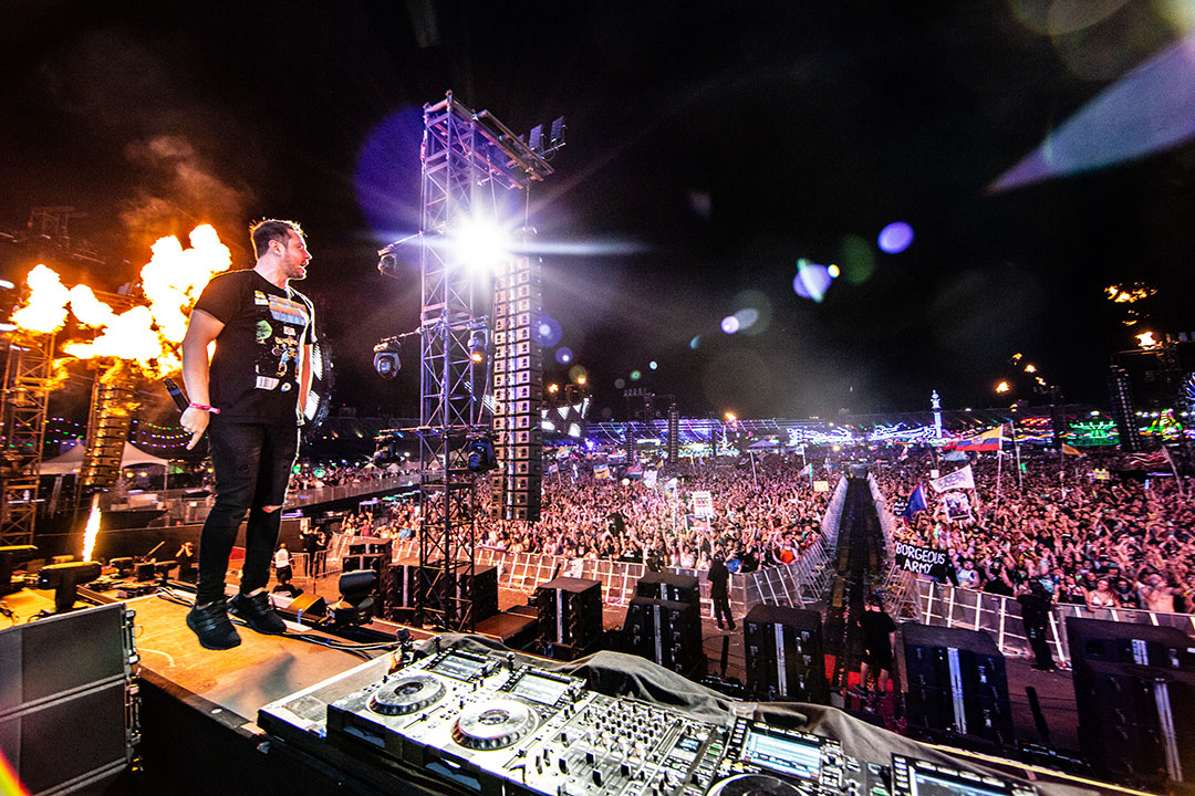 A DJ stands on the decks