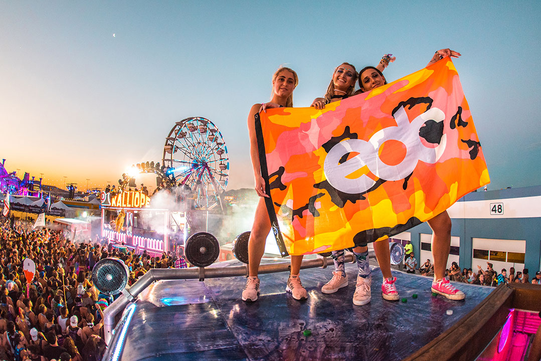 Girls holding an EDC flag