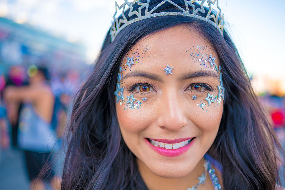 A closeup of a girl with face jewels