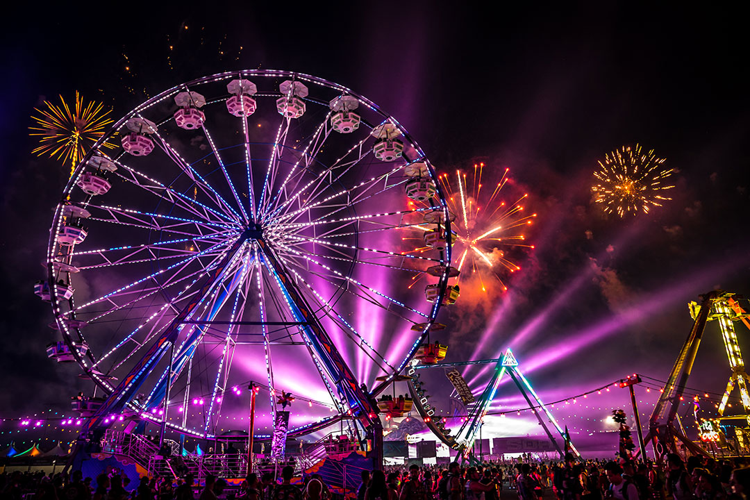 A Ferris wheel and fireworks