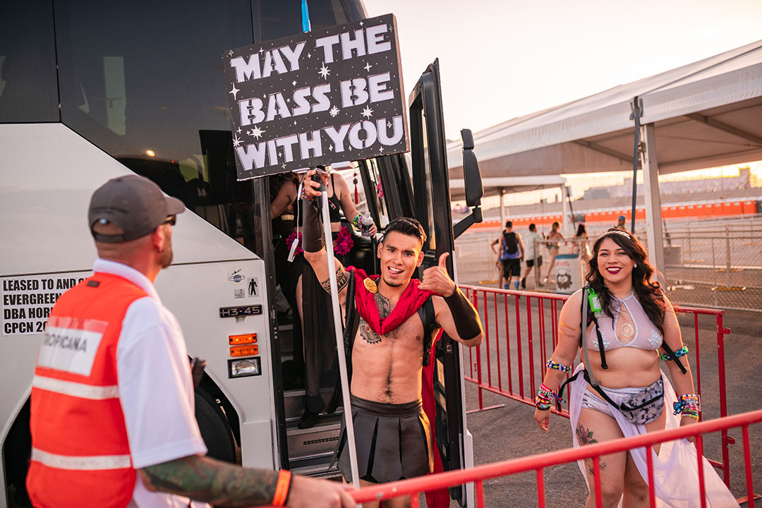 Headliner with totem getting off the shuttle