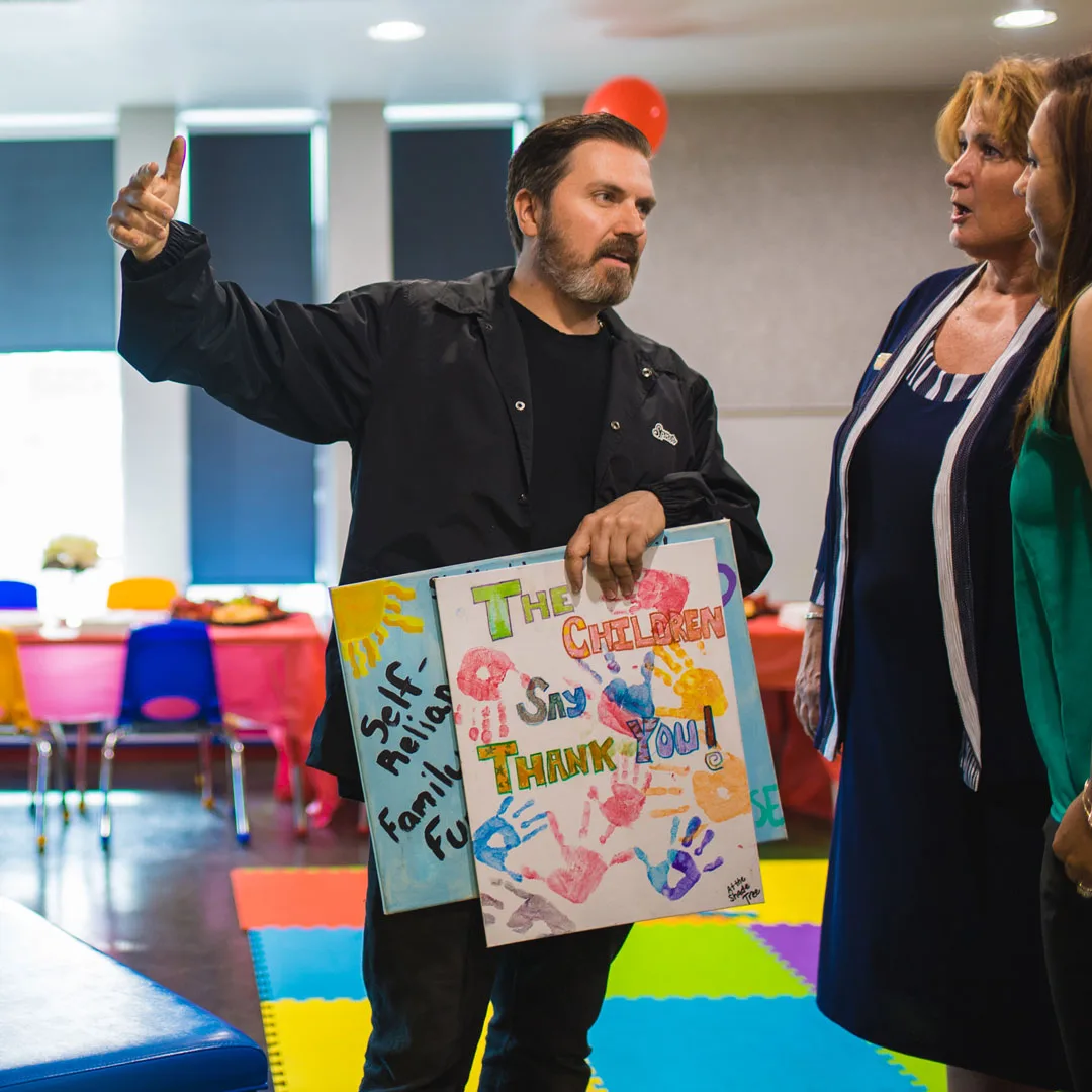 Pasquale Holding Sign