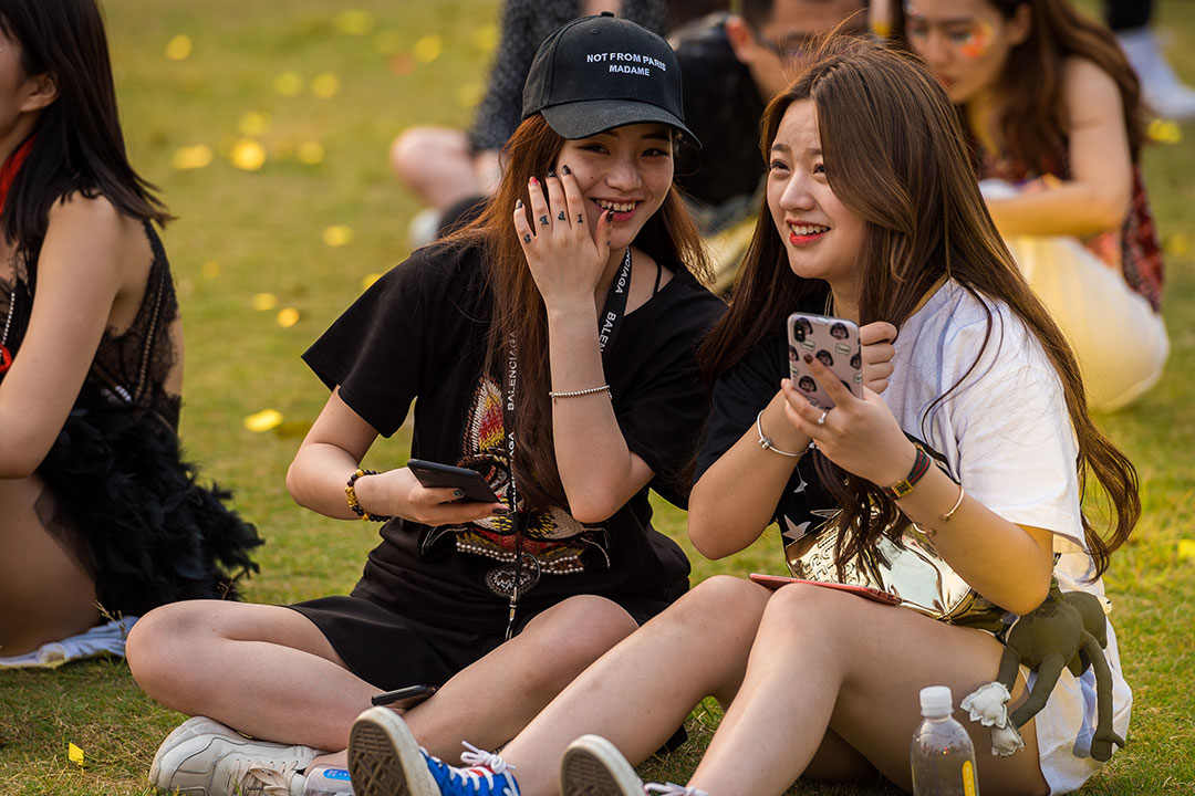 Two girls with phones