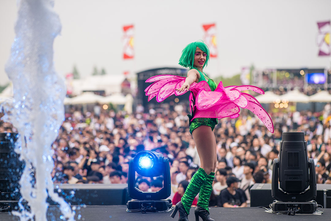 A performer dressed as a flower