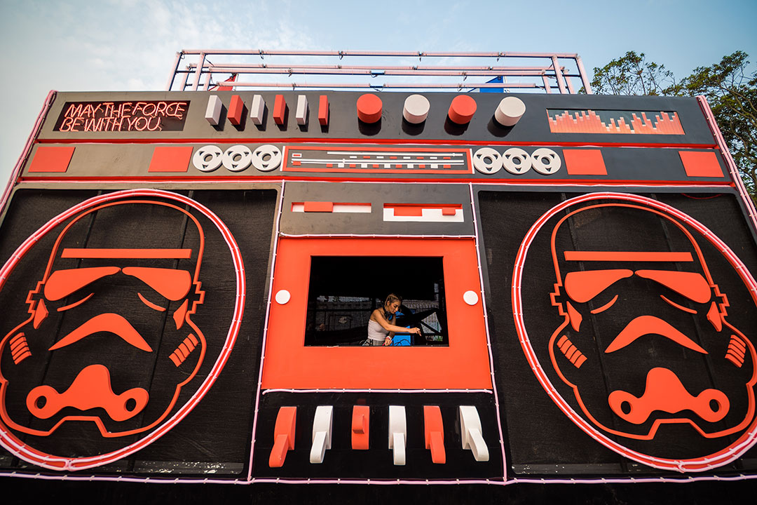 A DJ inside the tape deck of a giant boombox