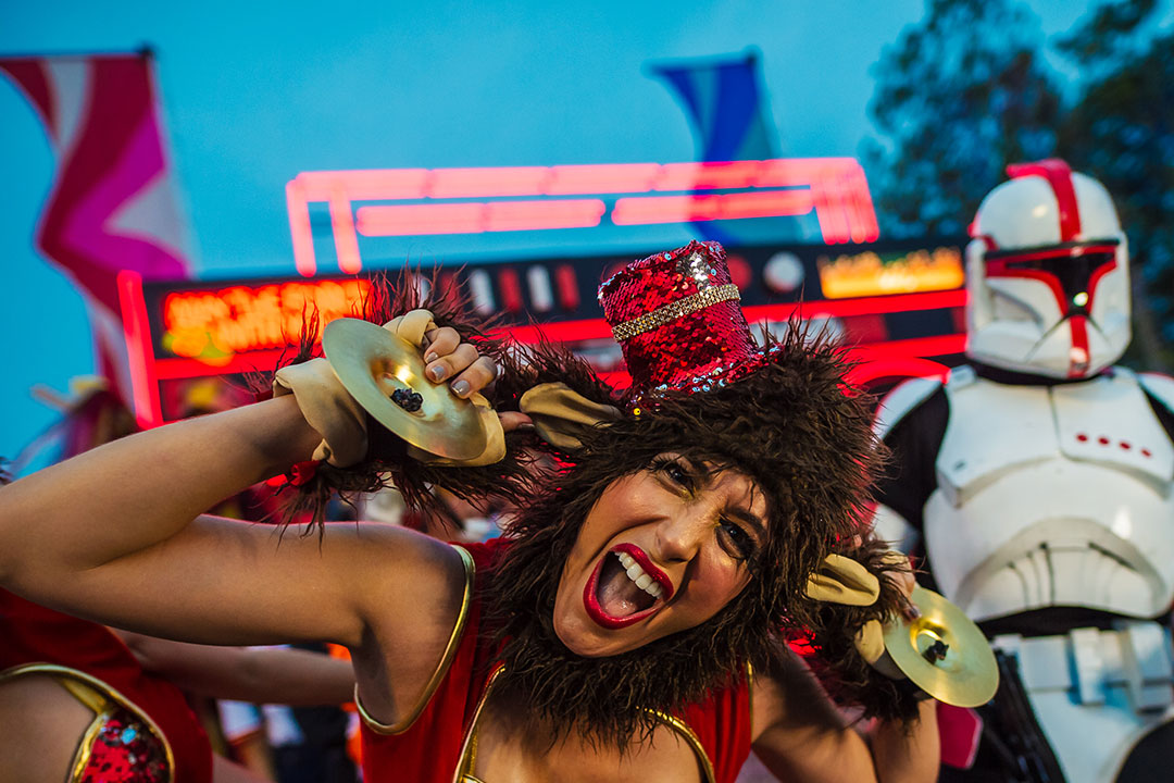 A monkey performer pulling her ears
