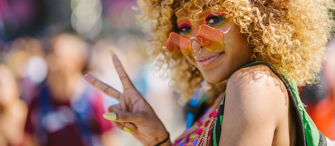 A woman making a peace sign